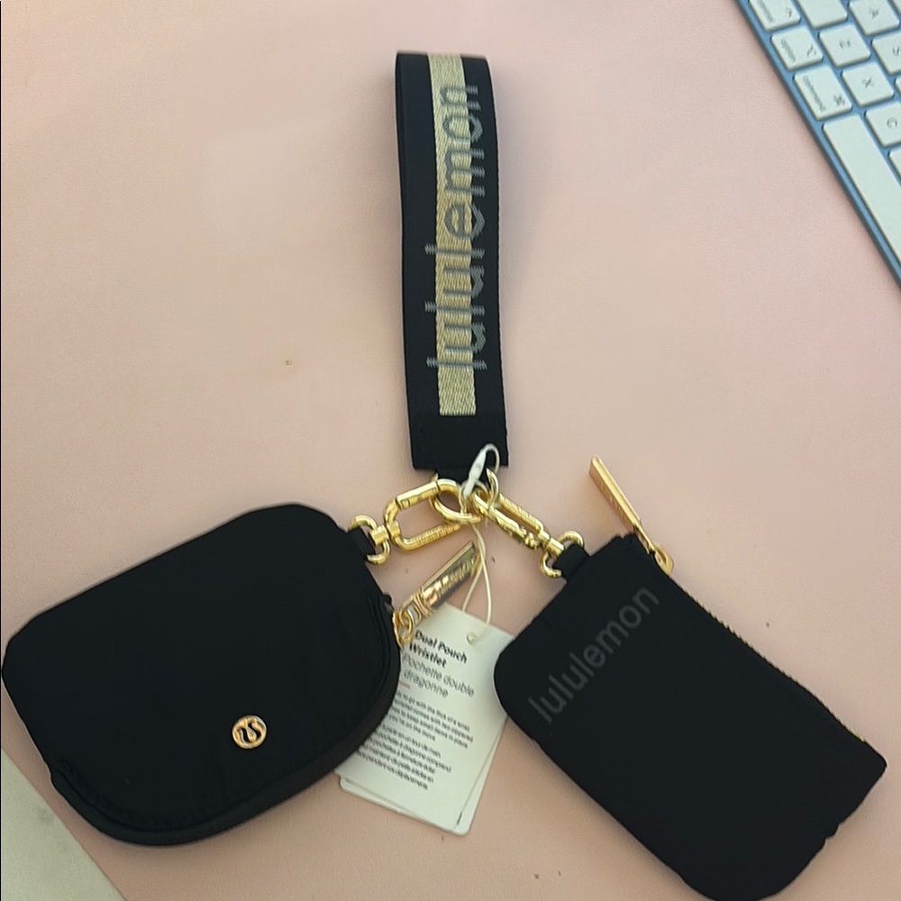 Lululemon Athletica Black and gold dual pouch wristlet